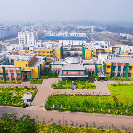 Aerial view of Mayfair World Cup Village, Rourkela, showcasing the vibrant and expansive facade of the hotel complex.