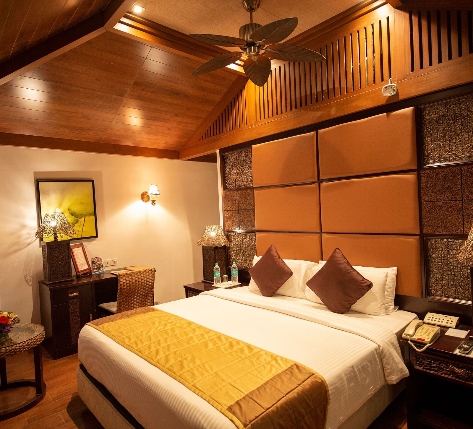 a double bed inside BERMUDA Villa Wooden themed bedroom at Ocean Spray Puducherry