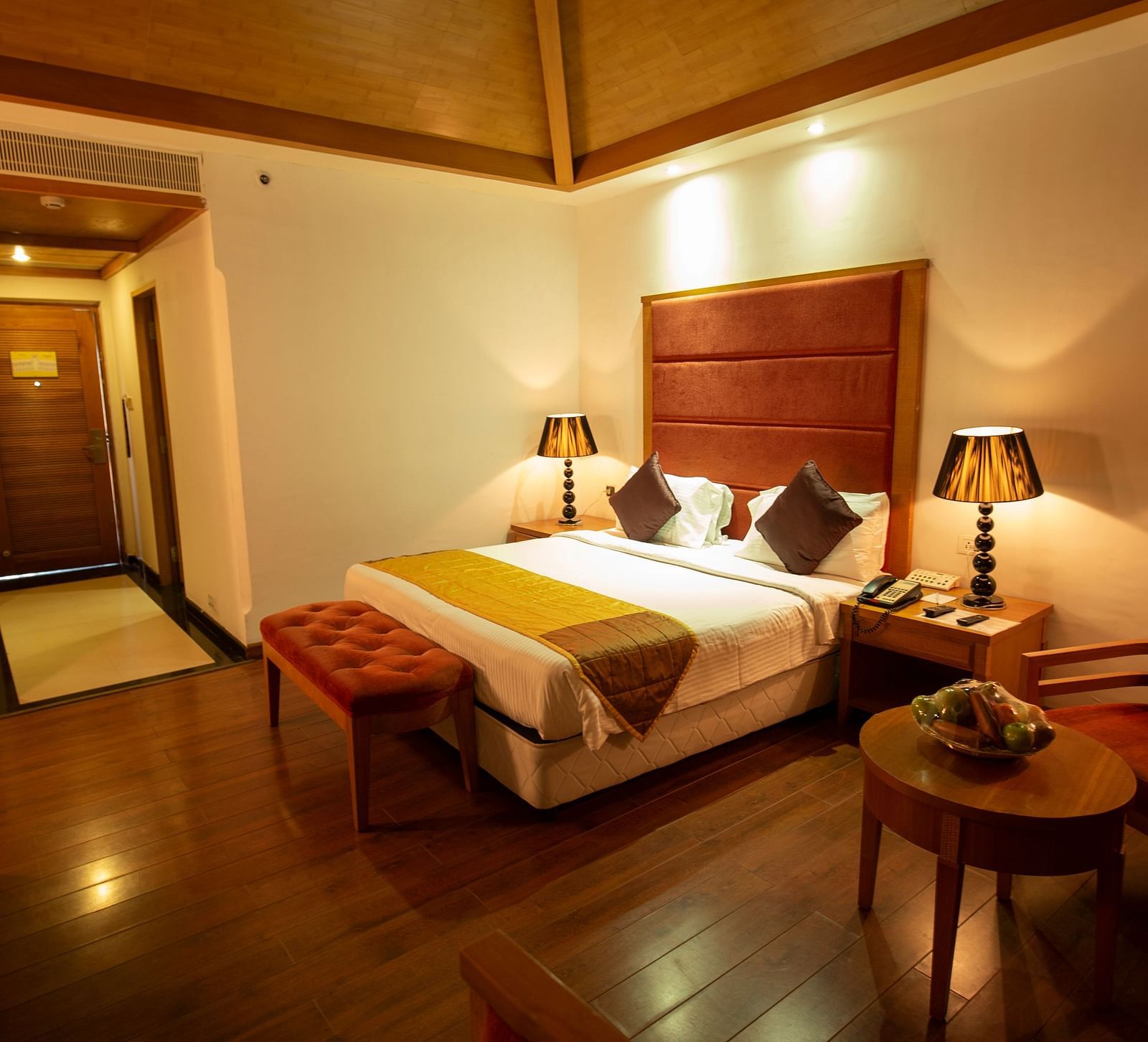 a double bed inside HEAVENS Category Room at Ocean Spray Puducherry