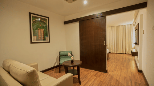 Lounge area of superior room at Grand Continent, Secunderabad with sofa seating