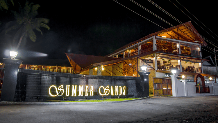 Facade of Symphony Summer Sand Beach Resort And Spa, the best resort resort in Neil Island, Andaman, with the signage Summer Sands written on its walls.