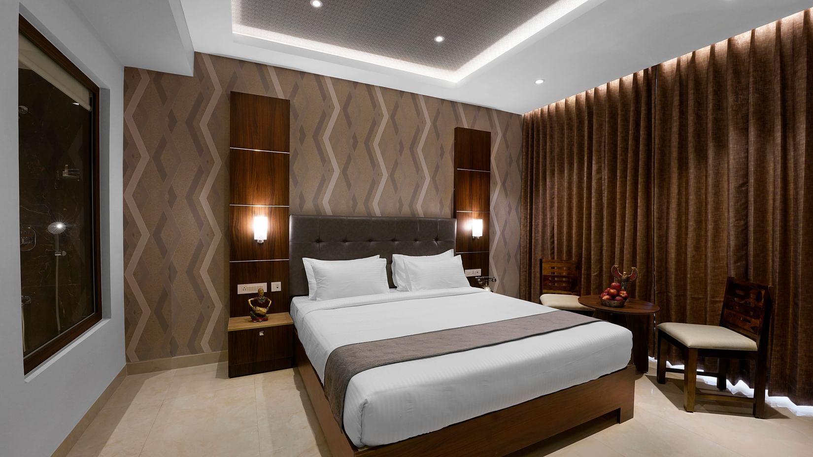 view of a king size bed offered at the premium room - Hotel Gwen by Rivido, Near Bannerghatta Road