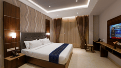  view of the king size facing the TV 1 - the indoor seating space at the restaurant 1 - the twin room offering twin beds with bedside lights facing the TV - Hotel Gwen by Rivido, Near Bannerghatta Road