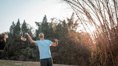 A close up shot of a person playing badminton - Karma Lakelands.