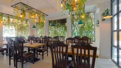 Puiicture featuring the dining area, well arranged tables and chairs - Magnus Aerith Studio, Kharadi