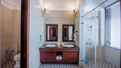overview of the bathroom with the sink and bath area inside Beach Mansion - Symphony Summer Sand Beach Resort And Spa, Neil Island