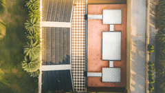 An image of an outdoor amphitheatre surrounded by walls and trees on all four sides - The Garden Ananta Elite, Rajkot 