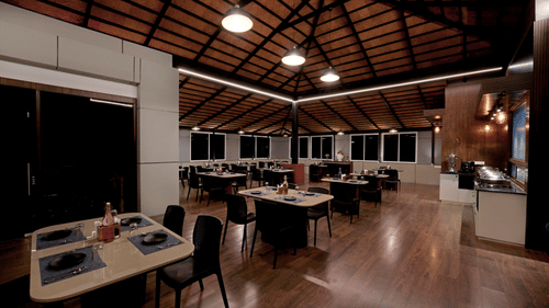 the indoor seating space at the restaurant 1 - the twin room offering twin beds with bedside lights facing the TV - Hotel Gwen by Rivido, Near Bannerghatta Road 1