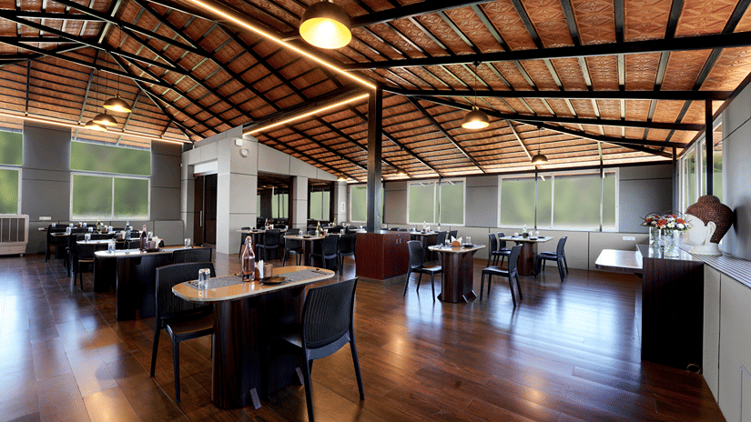An indoor restaurant at Hotel Gwen By Rivido, Near Bannerghatta Road.