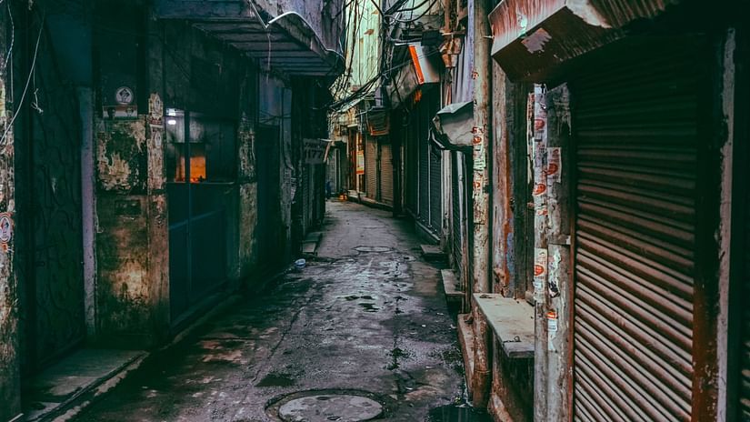backstreets of Kolkata with dingy roads, closed shutters on the buildings - Polo Floatel Kolkata
