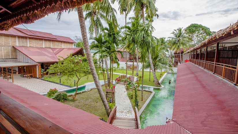 a view from the balcony of Symphony Summer Sand Beach Resort And Spa, Neil Island with coconut trees