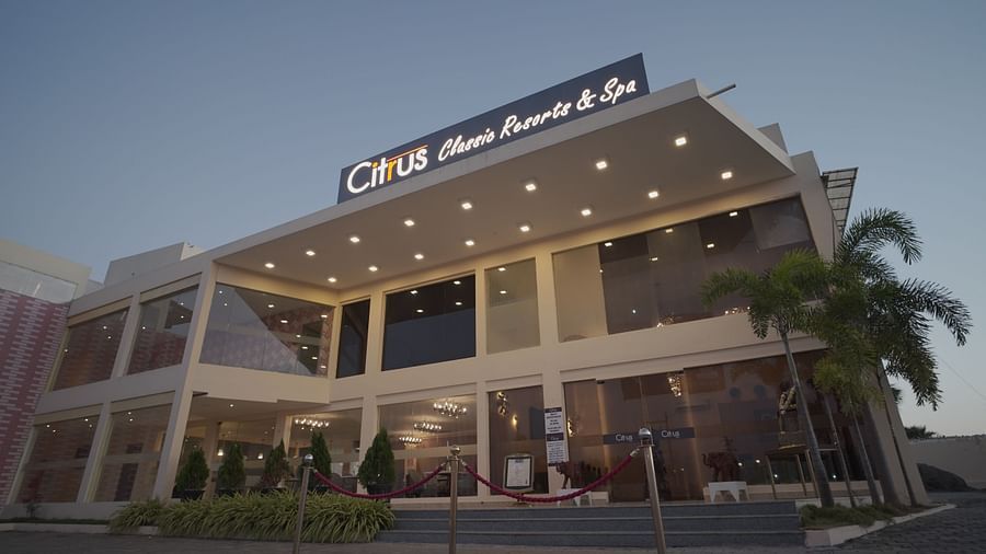 Facade of Citrus Classic Resorts and Spa Mahabalipuram ECR in the evening with all the lights on as the sun goes down