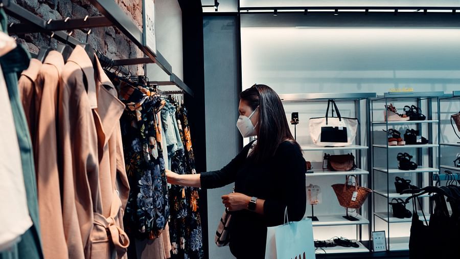 A woman checking out clothes