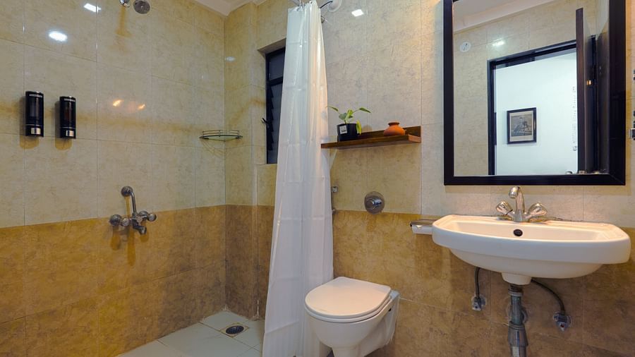 Bathroom with clean, minimalist design and essential amenities- Magnus Aerith Studio, Kharadi