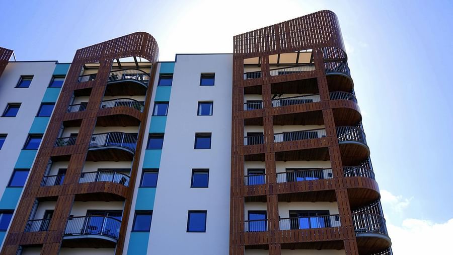 An image of an apartment with a clear blue sky in the background