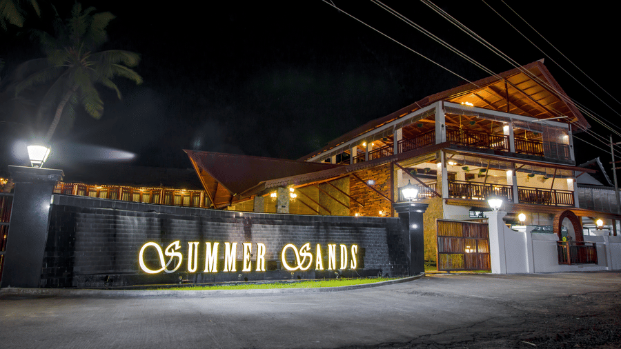 Facade of Symphony Summer Sand Beach Resort And Spa, the best resort resort in Neil Island, Andaman, with the signage Summer Sands written on its walls.