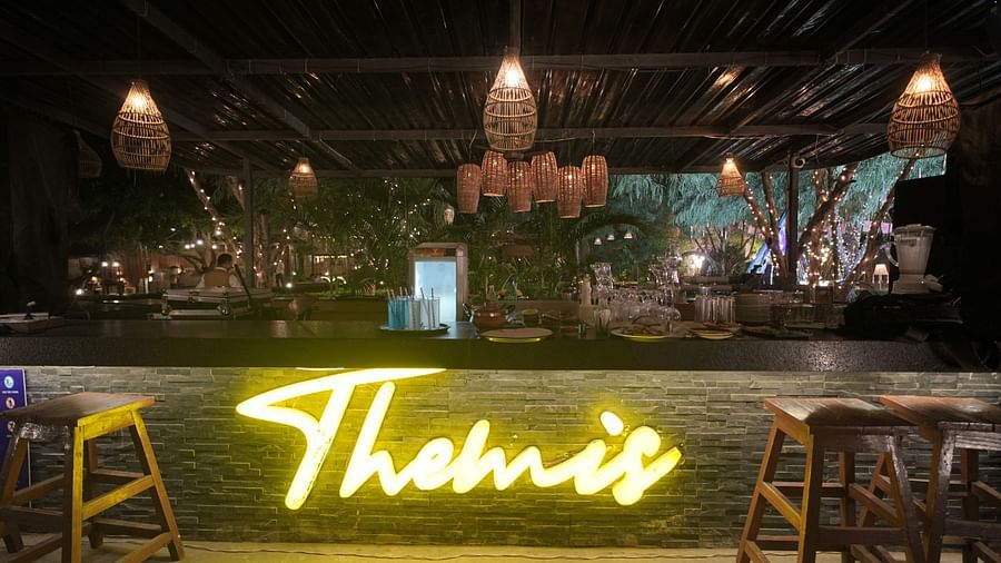 Decorated indoor venue with  Themis signage at Themis Mudhouse – A Nature's Retreat Resort & Wellness, set for a celebration or reception.
