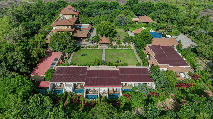 An aerial shot showing the layout of the resort villas and gardens within the forest | Anandam Jungle Retreat Resort, Udaipur