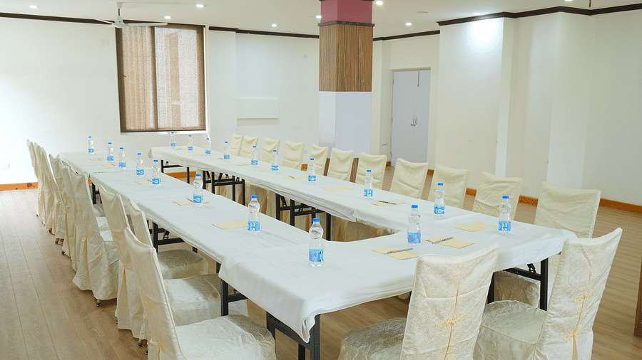 A large conference room with a long, rectangular table and chairs set up for a meeting | DLS Hotel Shiva Sanctuary & Spa, Dharamshala