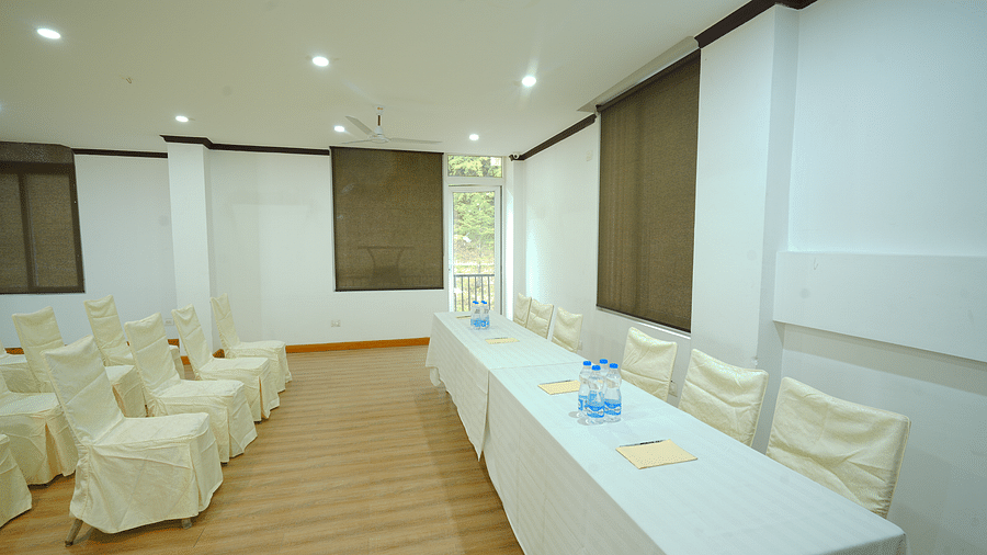A large conference room with a long table and chairs set up for a meeting | DLS Hotel Shiva Sanctuary & Spa, Dharamshala