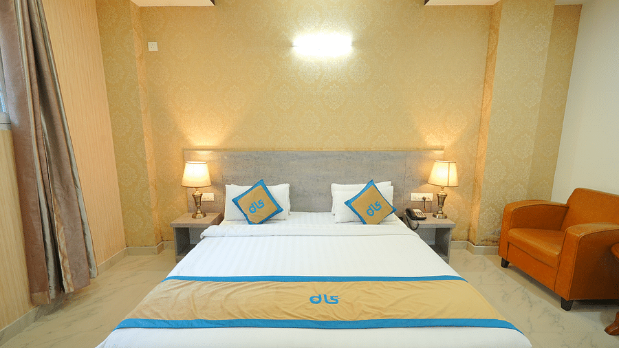 A close up shot of the bed in the deluxe room | DLS Hotel Shiva Sanctuary & Spa, Dharamshala
