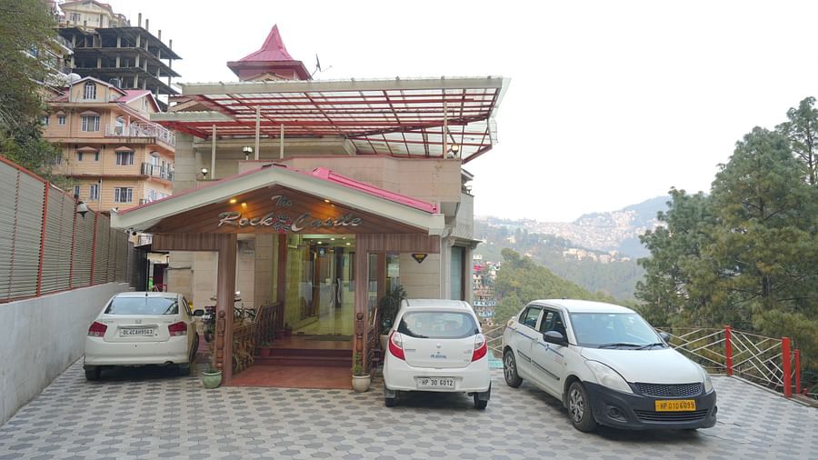 Facade of the DLS Hotels The Rock Castle, Shimla  with cars parked in the parking space.