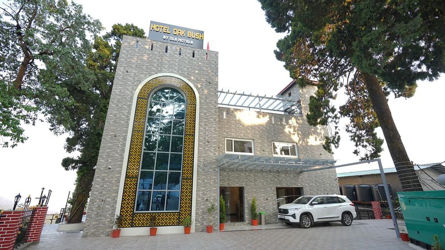 Facade view of DLS Oak Bush, Mussoorie with car parked outside.