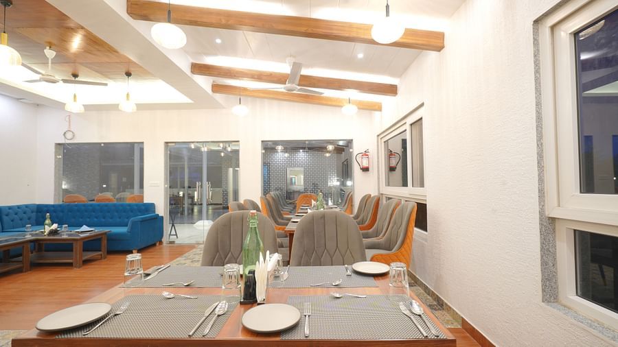 Dining seating of restaurant at DLS Oak Bush, Mussoorie.