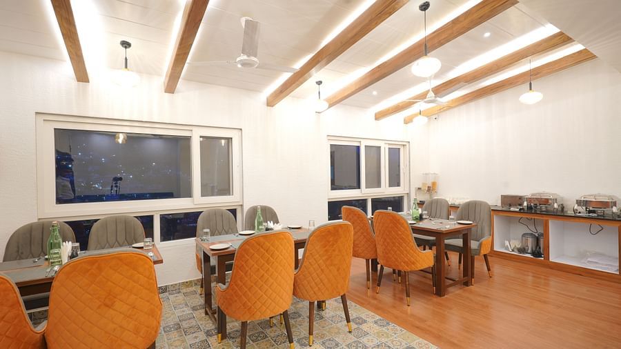 Dining seating of restaurant at DLS Oak Bush, Mussoorie.