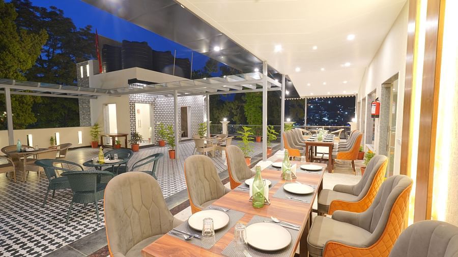 Dining area on the rooftop at DLS Oak Bush, Mussoorie.