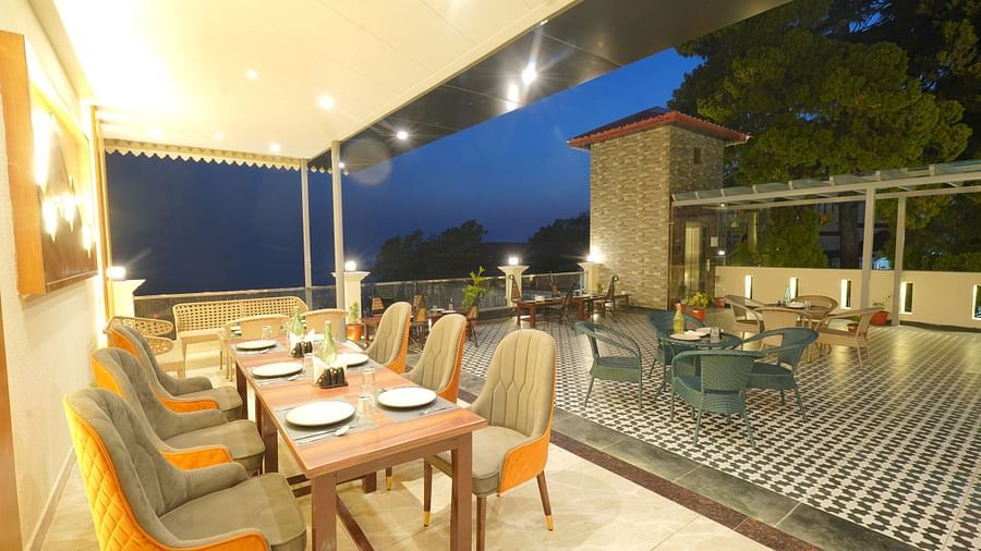 Dining area on the rooftop at DLS Oak Bush, Mussoorie.