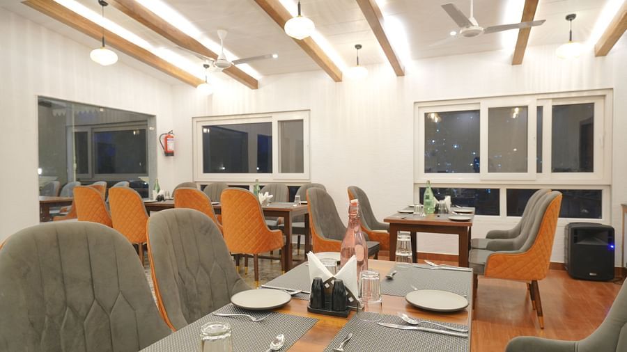 Dining seating of restaurant at DLS Oak Bush, Mussoorie.