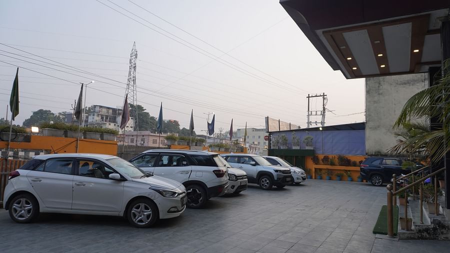 A row of cars parked in a lot outside of a building | DLS Park Grace, Haridwar