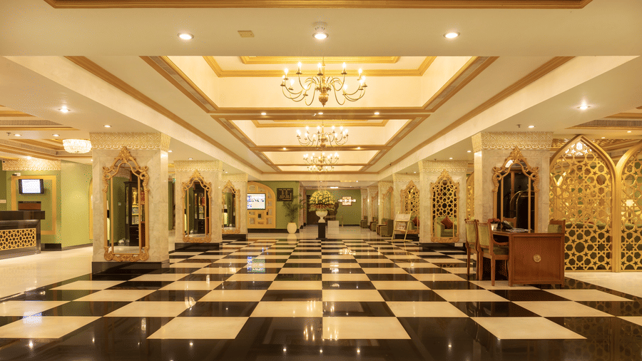 An overview of the lobby area with many chandeliers in view inside Hotel Clarks Shiraz, Agra, the Best 5-Star Hotel in Agra.