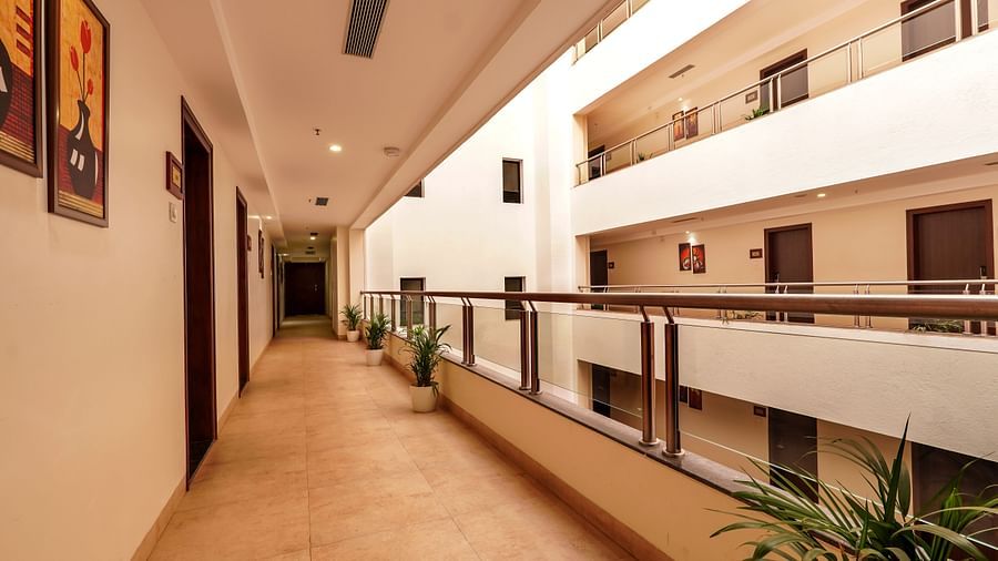 alt-text corridor outside rooms offering a beautiful view - Magnus Square Viman Nagar