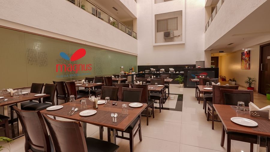 alt-text wide angle view of dining area at a restaurant - Magnus Square Viman Nagar1
