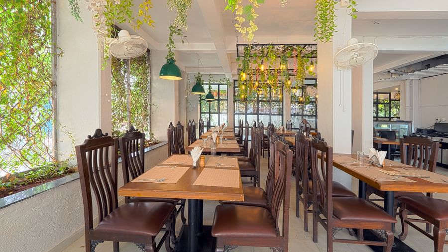 alt-text Puiicture featuring the dining area, well arranged tables and chairs - Magnus Aerith Studio, Kharadi