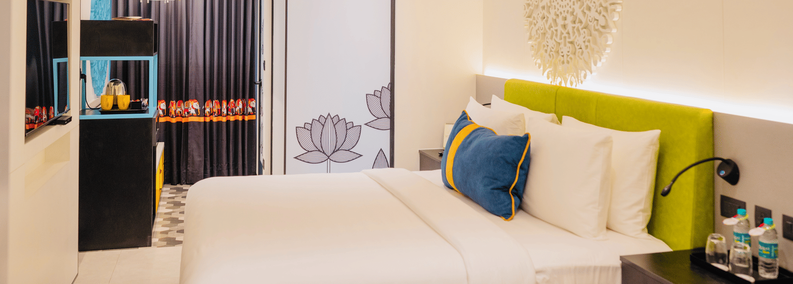 Side view of one of the hotel rooms in Kakinada with tea and coffee maker at Zibe Luxe Kakinada by GRT Hotels.