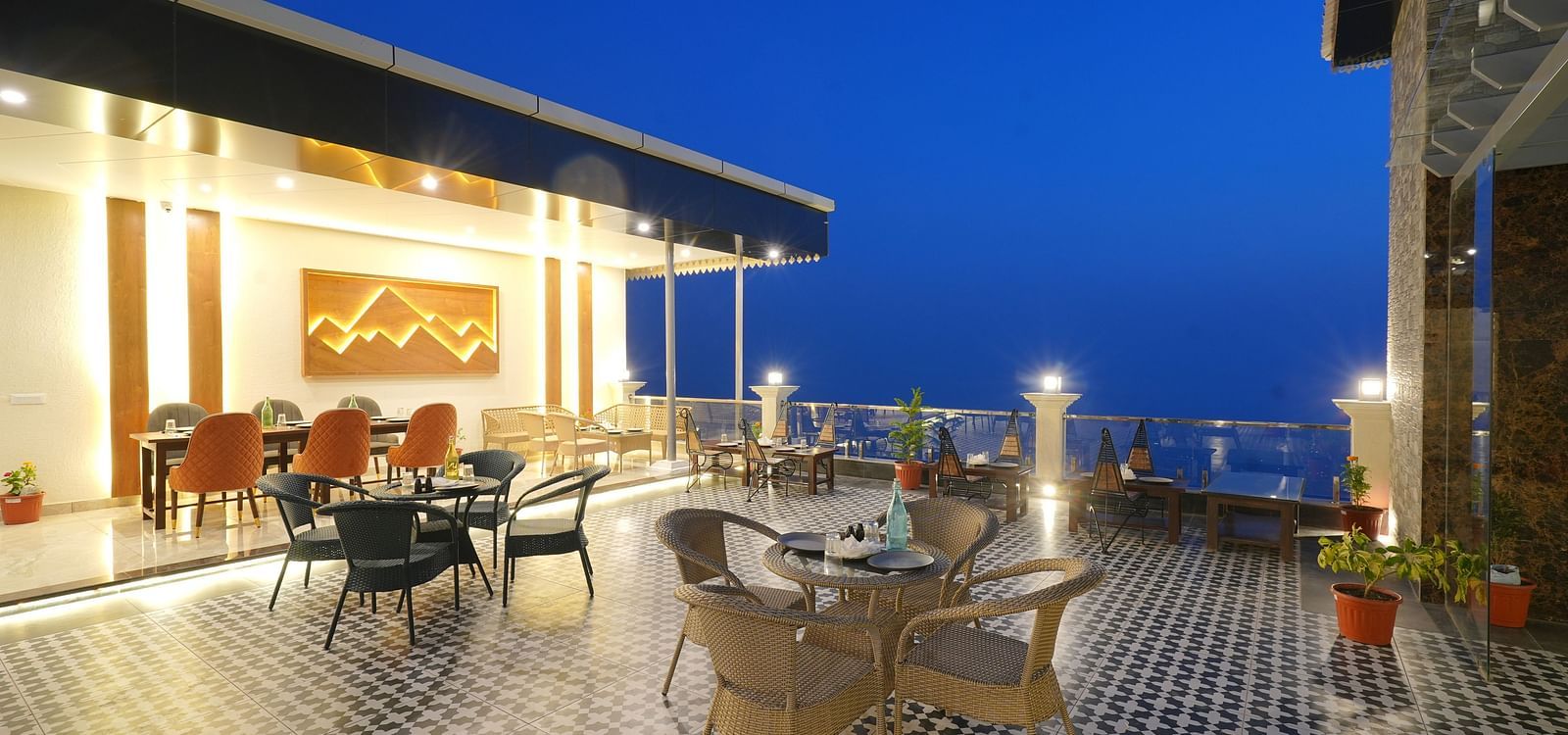 Rooftop dining area during the evening at DLS Oak Bush, Mussoorie.