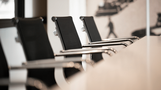 arranged chairs in a conference room