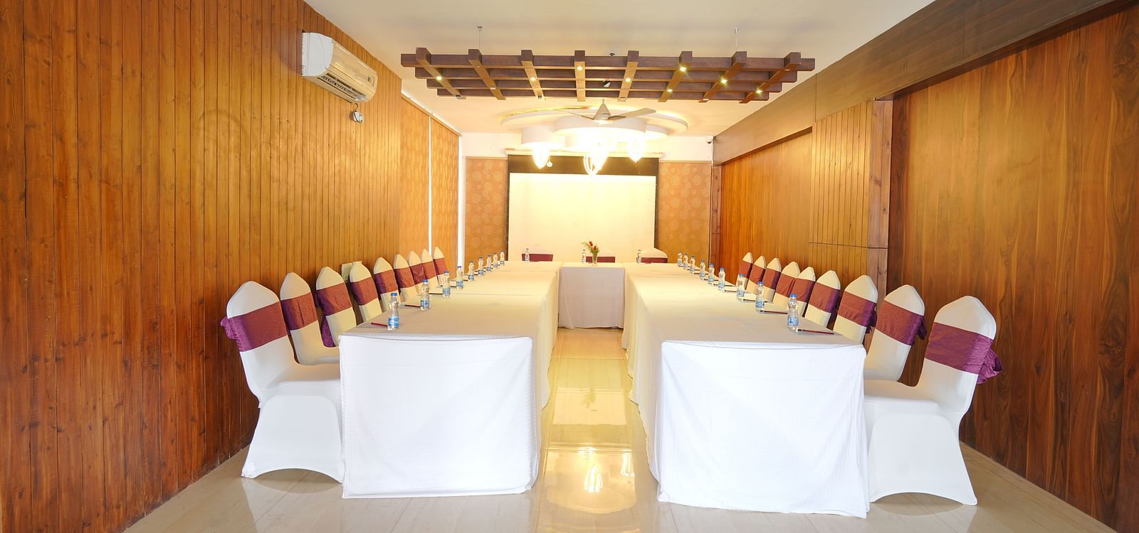 The image of the conference hall at DLS Whispering Winds with u-shaped seating arrangement