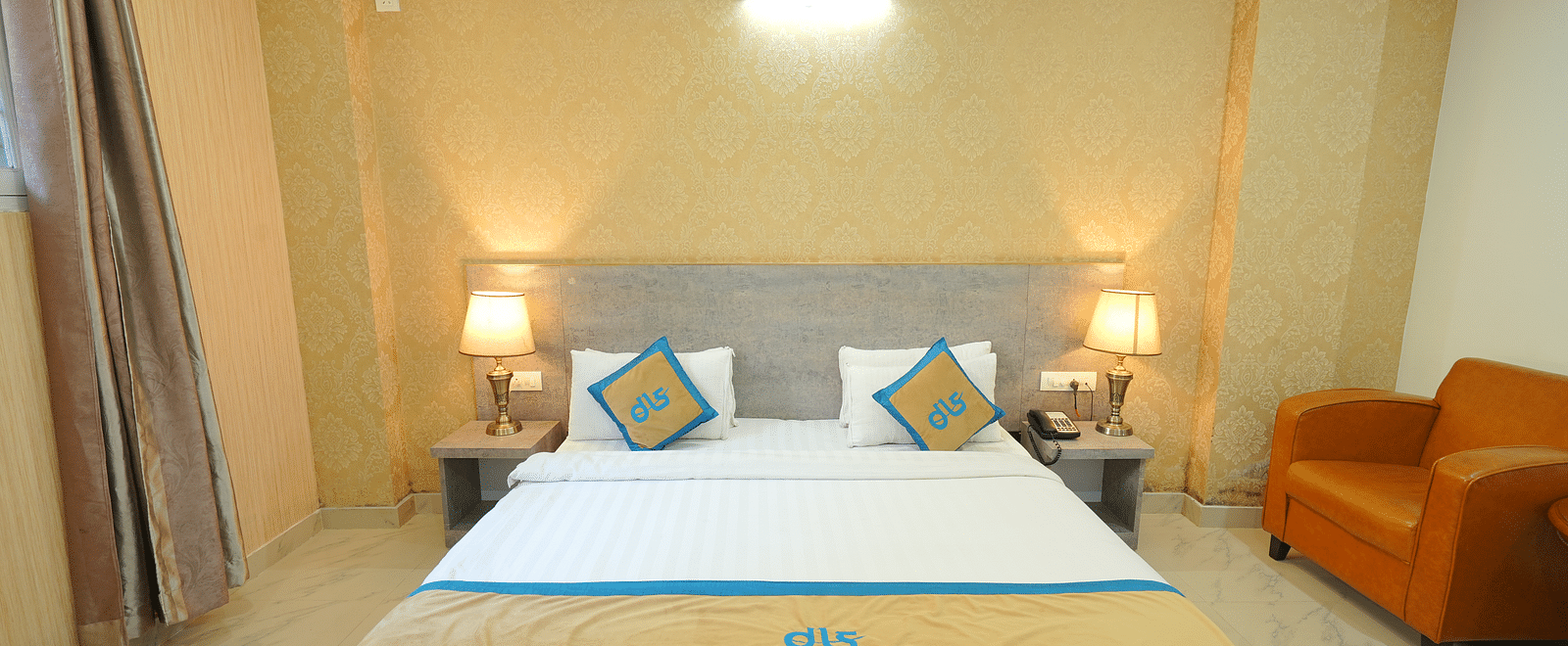 A close up shot of the bed in the deluxe room | DLS Hotel Shiva Sanctuary & Spa, Dharamshala