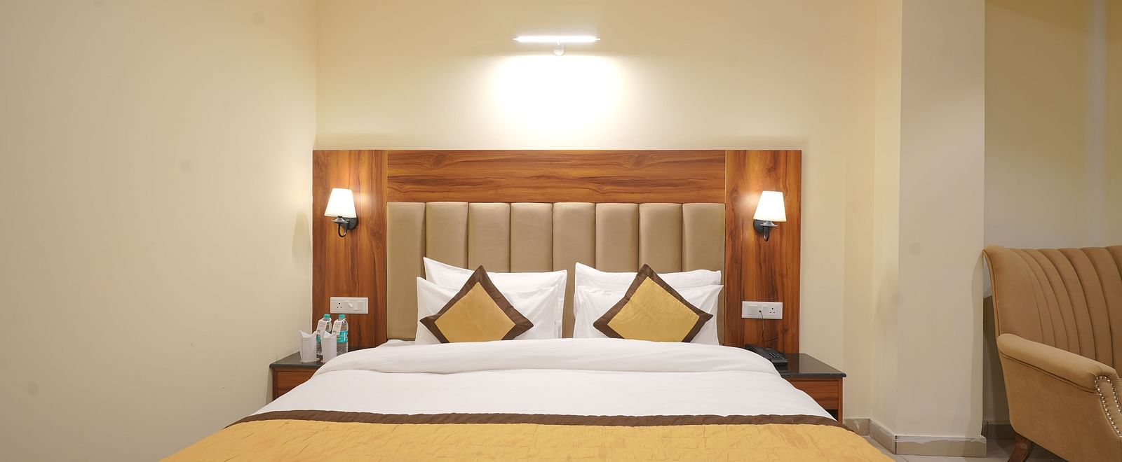 A large bed in Premium Room at DLS Oak Bush, Musssoorie.