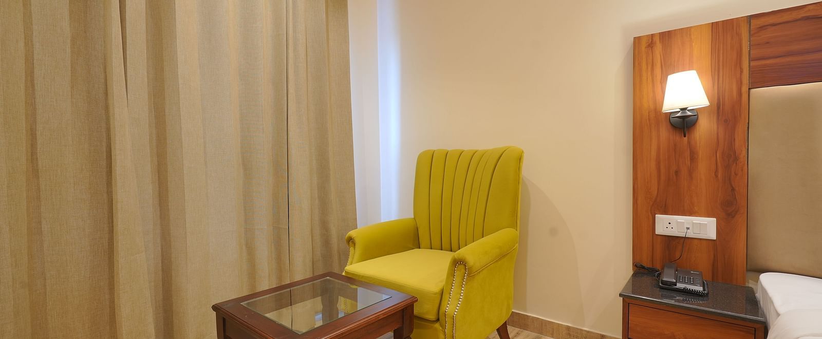 A sofa in front of the table at Premium Room at DLS Oak Bush, Musssoorie.