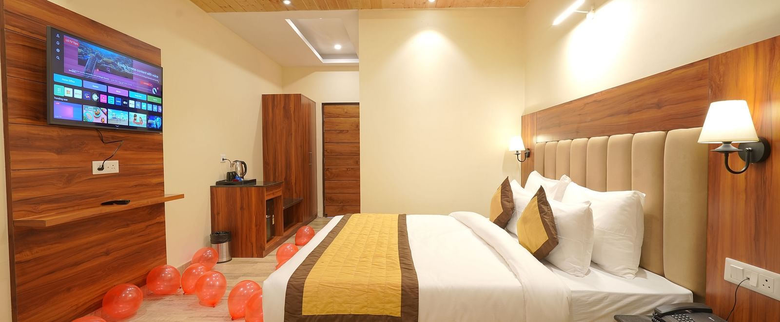 A large bed in Deluxe Room at DLS Oak Bush, Musssoorie.