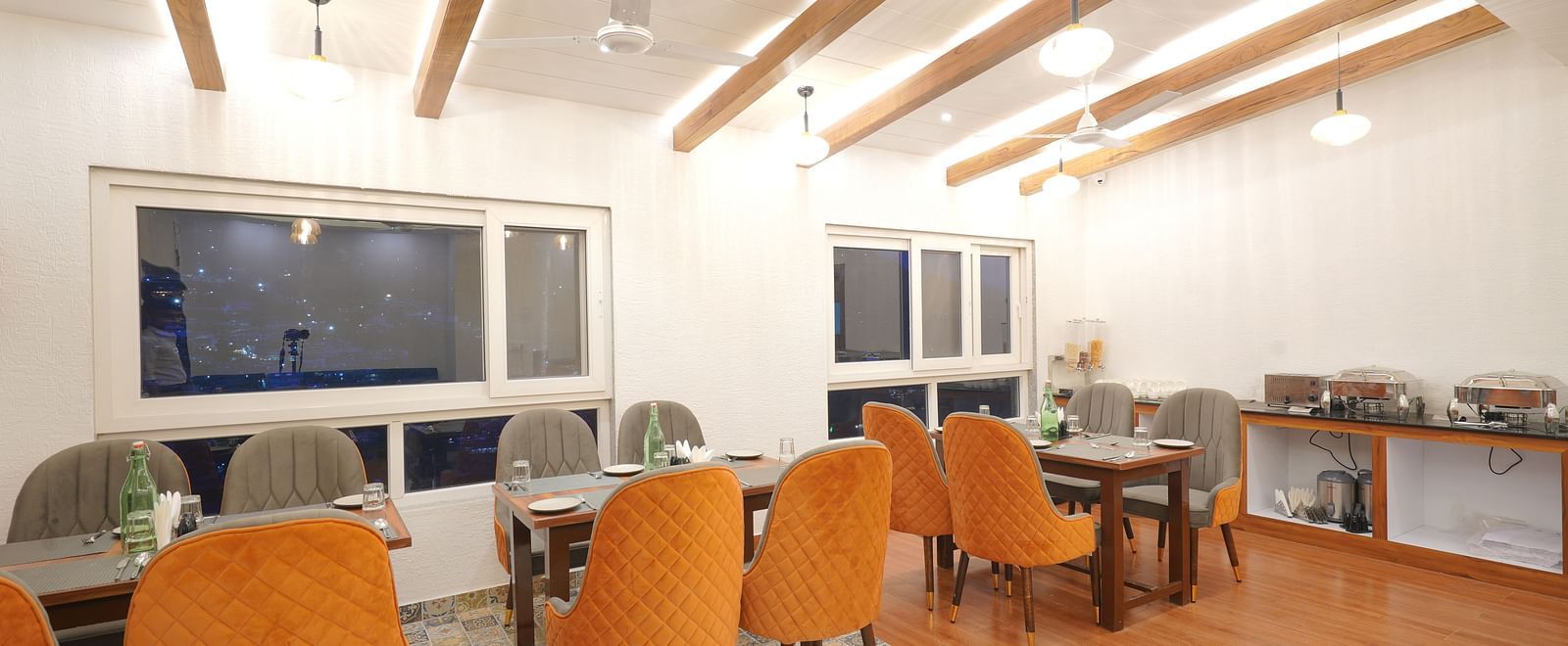Dining seating of restaurant at DLS Oak Bush, Mussoorie.