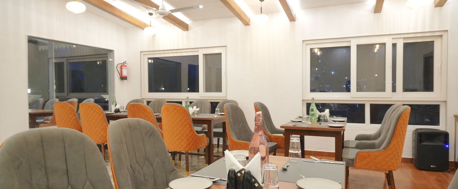 Dining seating of restaurant at DLS Oak Bush, Mussoorie.