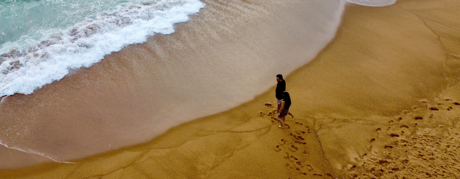 a person standing on the beach at our resort in south goa - Caravela Beach Resort Goa