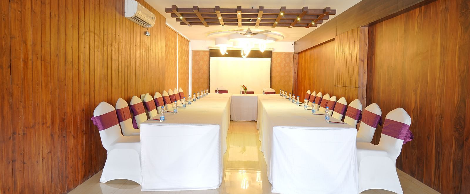 The image of the conference hall at DLS Whispering Winds with u-shaped seating arrangement