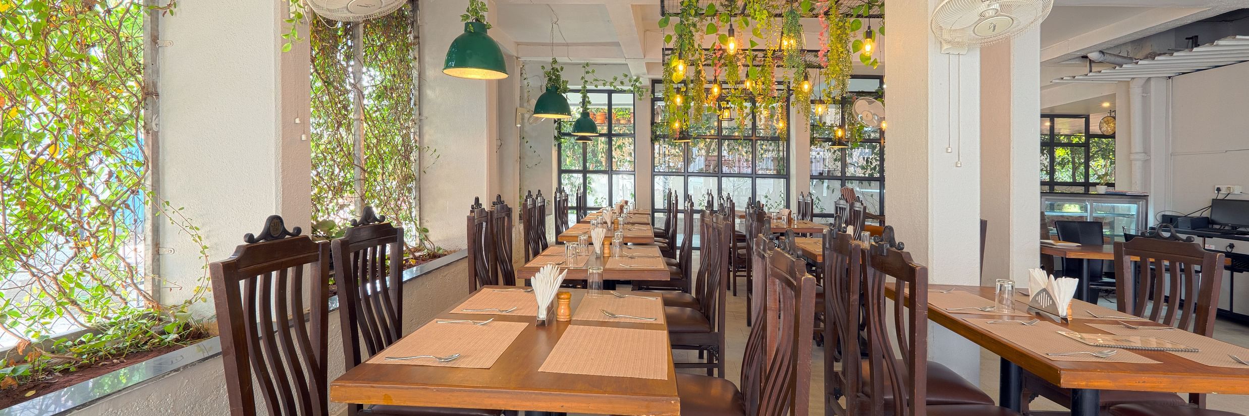 Puiicture featuring the dining area, well arranged tables and chairs - Magnus Aerith Studio, Kharadi